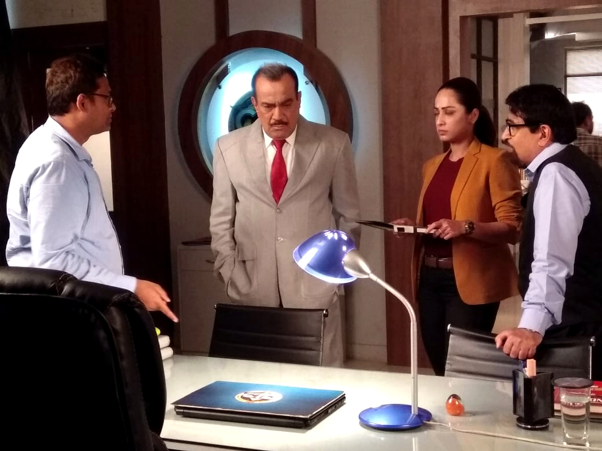 Haroon Rashid directing the cast on the set of the CID television series